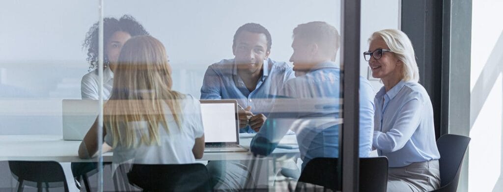 smiling boardroom of people